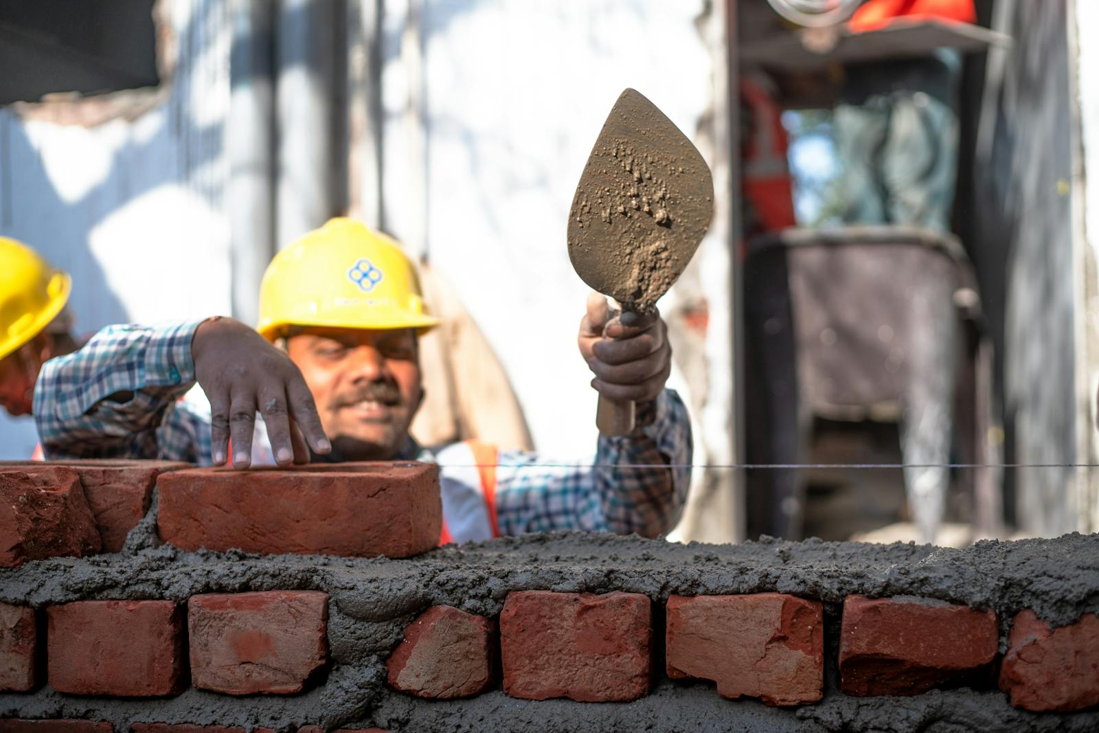 Construction team and site supervision work in Delhi